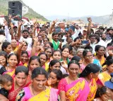 People sprinkle Krishna water on heads and carry bottles at Veligonda Project