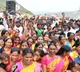 People sprinkle Krishna water on heads and carry bottles at Veligonda Project