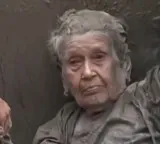 Guna Maya Bohara 91 year old woman survives after keeping head above mud water for hours