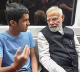 Narendra Modi surprises passengers in Delhi Metro and interacts with children