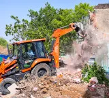 HMDA demolishes 60 acre illegal layout in Janwada