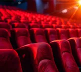 Why do movie theater seats automatically flip up