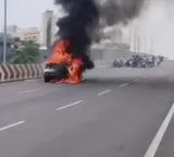 Car burnt on Vijayawada Benz Circle new flyover
