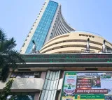Sensex, Nifty end lower; IT, banks cushion losses