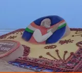 PM Modi Birthday Sudarsan Pattnaik Creates Sand Art With 2500 Lamps At Puri Beach