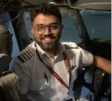 Captain Smith Macher health update Indian pilot smiling and chatting with family