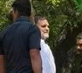 Rahul Gandhi climbs barricade high drama in front of Election Commission