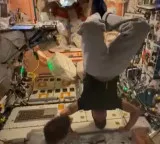 Anil Menon performs headstand in space and explains importance of exercise