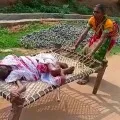 Manager suspended for forcing woman to drag elderly mother on cot to bank in Odisha