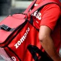 Zomato Employees Protest and burn Their T Shirts in Kolkata