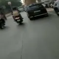 An onduty Traffic Police personnel was dragged on the bonnet of a car