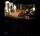 Corona victims dead bodies dumped into grave with an earth mover