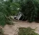 woman who was washed away in the canal along with the car in  Gadwal