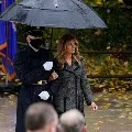 Melania Trump walks with soldier
