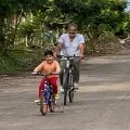 Prakash Raj cycling with his family members at farm house