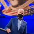 Joe Biden reacts after President Donald Trump and Melania Trump
