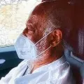 Rajinikanths driving car with a mask