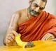 Chinna Jeeyar Swamy feeds a tortoise in his Ashram