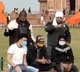 Youth held waving saffron flags at Taj Mahal