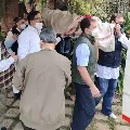 Congress leader Rahul Gandhi gives shoulder to the mortal remains of party leader Captain Satish Sharma