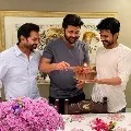 ram charan gives surprize to sharvanand