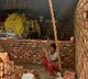 farmers constructing homes