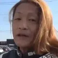 A woman biker is actually A man