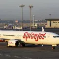 Man tries to open emergency door while plane in midair