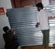 BBMP Officials Seal Two Houses with Metal Sheets