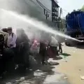 Migrant workers sprayed with disinfectant in Delhi