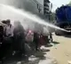 Migrant workers sprayed with disinfectant in  Delhi