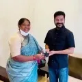 Seethakka ties Rakhi to Revanth Reddy as gifted him with a mask and sanitizer