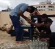 Youth removes battle caps with forehead as Guinness recognized the record
