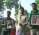 Supporters of RJD leader Tejashwi Yadav outside his residence