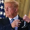 Trump Removes Mask