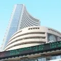 Sensex ends 63 points low