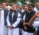 Rahul Gandhi and other Congress MPs protest near Mahatma Gandhi statue at Parliament