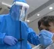 Workers at Salon in Gujarats Kheda wear PPE kits while giving haircuts