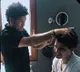 Sachin turns hairstylist for his son