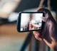 Man shooting videos while women bathing