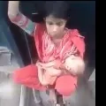 Woman with child sitting on train compartment link as police officer felt emotional